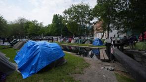 Asylum seeker tents not removed because of Europa League final, says Eamon Ryan