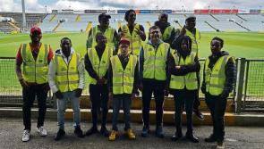 Members of Limerick migrant community help out at  hurling championship match