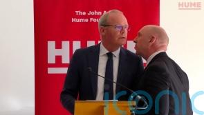 Two arrested over security threat at peace event attended by Coveney