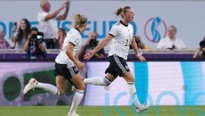 Germany ease to win over Spain to qualify as group winners