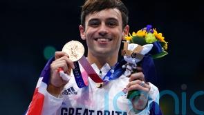 Diver Tom Daley among athletes carrying Commonwealth Games baton