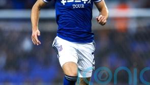 Ipswich brush aside MK Dons to go top of League One