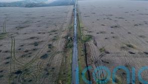 At least 20 killed as Russian forces bomb evacuation convoy in Ukraine