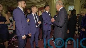 King makes a splash with Olympic stars at palace reception