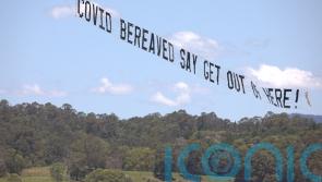 Covid campaigners fly plane with 35ft banner over I'm A Celeb jungle