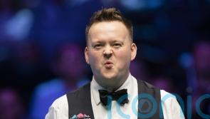 Shaun Murphy defies injury to knock Judd Trump out of UK Snooker Championship