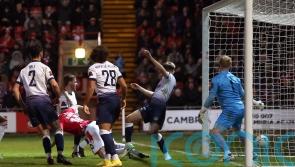 Paul Mullin hat-trick fires Wrexham into round three