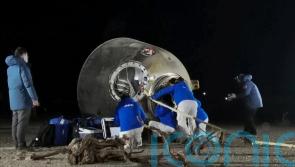 Astronauts return to Earth after six-month mission