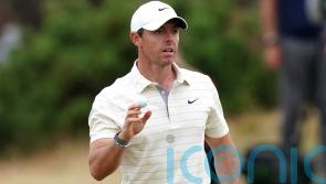 Rory McIlroy finishes superbly to take share of lead with rival Patrick Reed