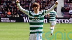Celtic wrap up league title with victory at 10-man Hearts