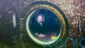 Professor sets record for living underwater