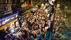 Manchester City fans take over streets of Istanbul with flares and chants