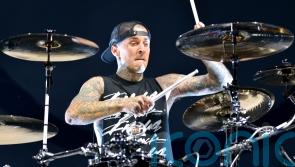 Blink-182 postpone gigs as Travis Barker rushes home for &lsquo;urgent family matter&rsquo;
