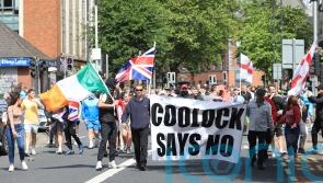 Harris expresses &lsquo;disgust&rsquo; at Irish tricolour flown during attacks on police