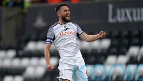 Swansea breeze to first league win of the season against managerless Preston