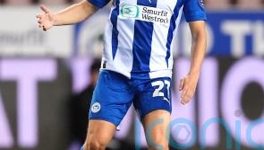 Scott Smith and Jonny Smith send Wigan past 10-man Carlisle in extra time