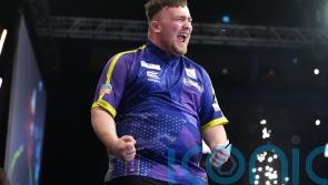 Luke Littler fights back to edge out Mike De Decker at Grand Slam of Darts