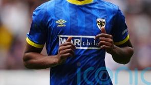 Josh Neufville&rsquo;s sublime strike helps keep promotion-chasing Wimbledon on track