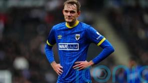 AFC Wimbledon bolster promotion bid with win at relegation-threatened Carlisle