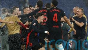 Barcelona clinch LaLiga title with victory at 10-man Espanyol
