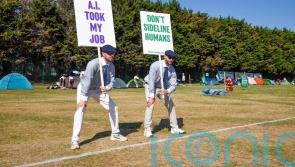 Uniformed protesters criticise introduction of AI line calls at Wimbledon
