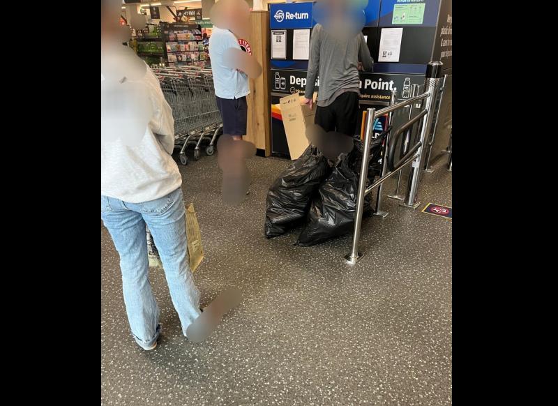 People divided over man at Deposit Return machine with two big black bags of bottles
