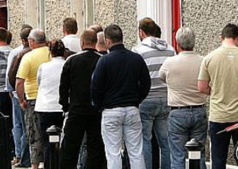 Dole queue outside the Social Welfare Office, Portarlington. Photo: Michael Scully .