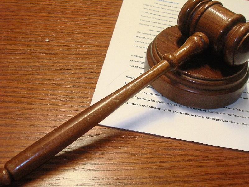 Men charged in connection with armed robbery where customer was held at knifepoint