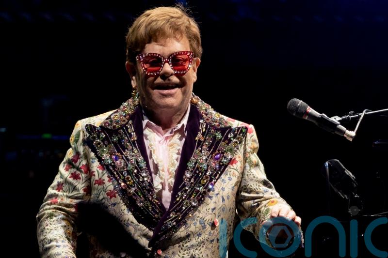 Elton John pauses farewell tour after testing positive for Covid-19