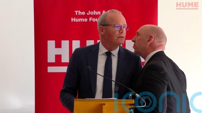 Two men arrested over security threat at NI peace event attended by Simon Coveney