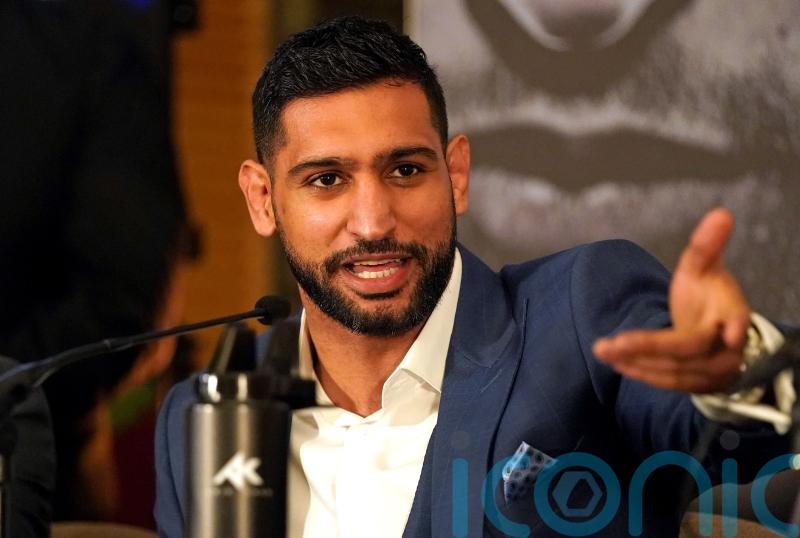 Three men charged after boxer Amir Khan &lsquo;robbed at gunpoint&rsquo;