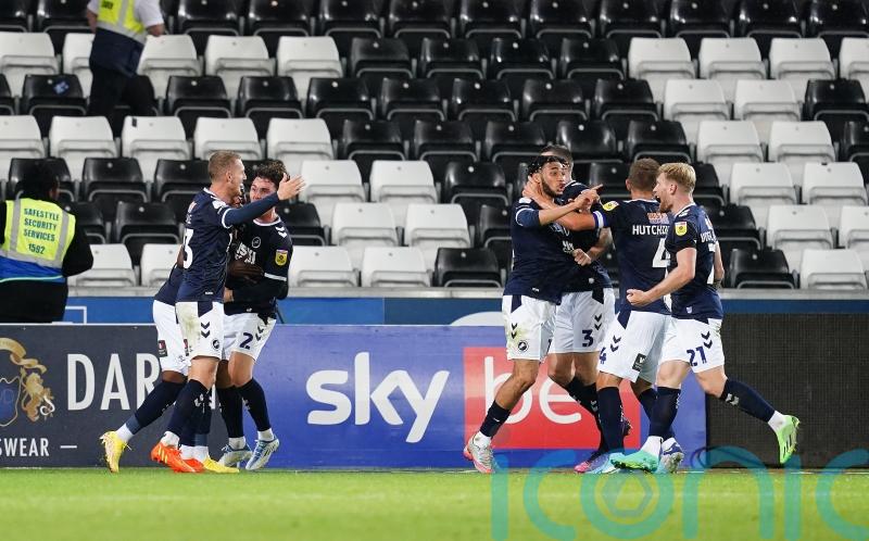 Two own goals in added time earn Millwall a draw at Swansea