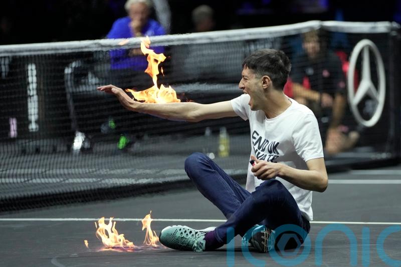 Players stunned as protester sets arm on fire in dramatic incident at Laver Cup
