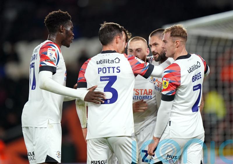 Managerless Hull lose again as Henri Lansbury puts the seal on Luton victory