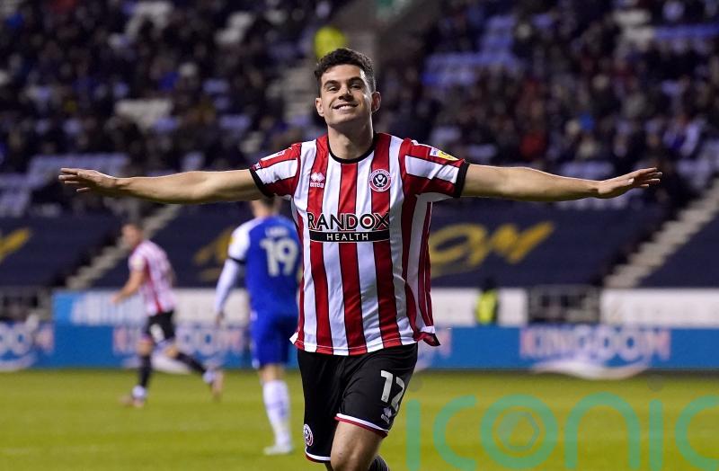 Sheffield United beat Wigan to cement second-place spot in the Championship