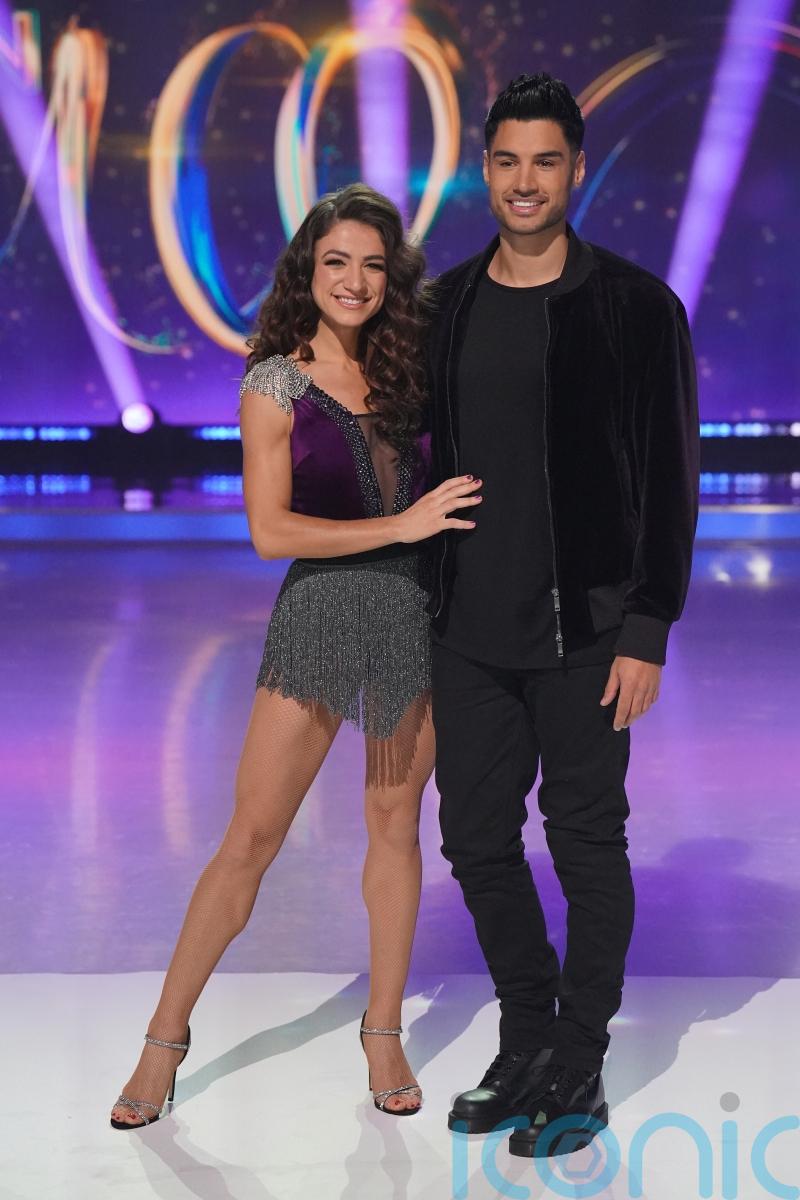 Jay McGuiness helps Siva Kaneswaran with dancing in surprise Dancing On Ice visit