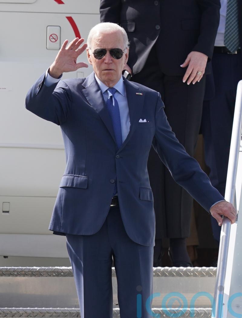 Biden looks at plaque in memory of late son and meets distant cousin at hospice