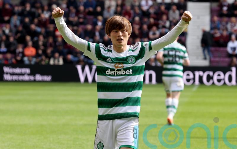 Celtic wrap up league title with victory at 10-man Hearts