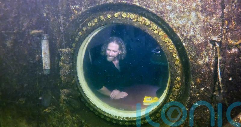 Professor sets record for living underwater