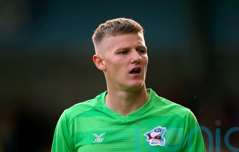Jake Eastwood saves penalty on Grimsby debut to earn point against AFC Wimbledon