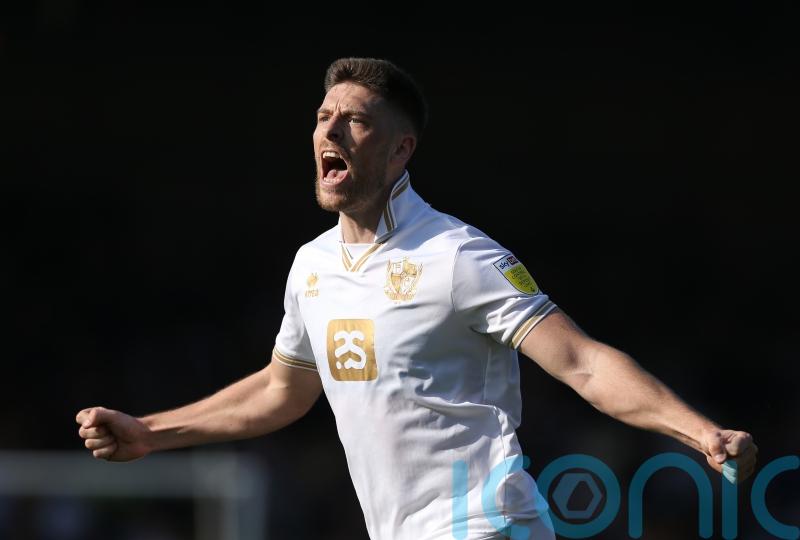 Barrow fight back to beat 10-man Sutton with late goals