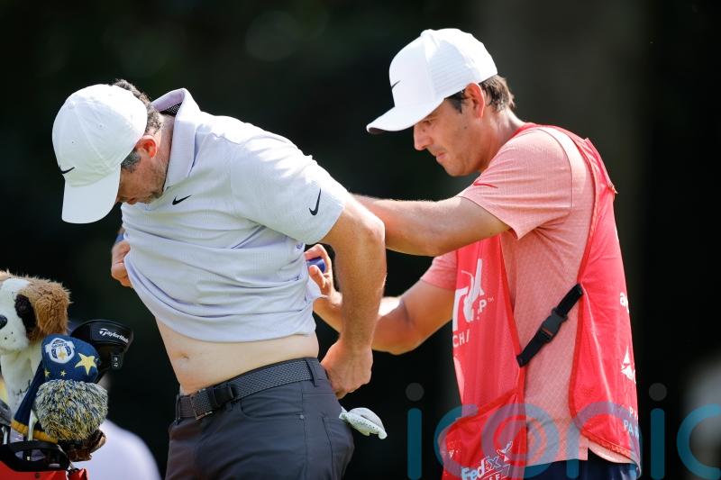 Rory McIlroy three behind lead despite muscle spasms leading into tournament