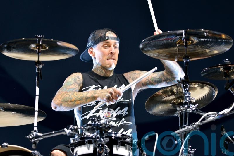 Blink-182 postpone gigs as Travis Barker rushes home for &lsquo;urgent family matter&rsquo;
