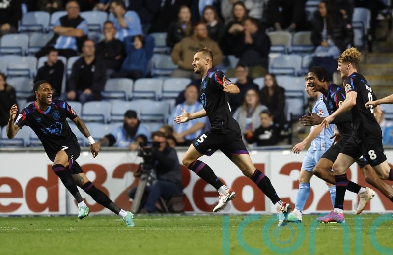Late goal gives Darren Moore a draw in his first game as Huddersfield boss
