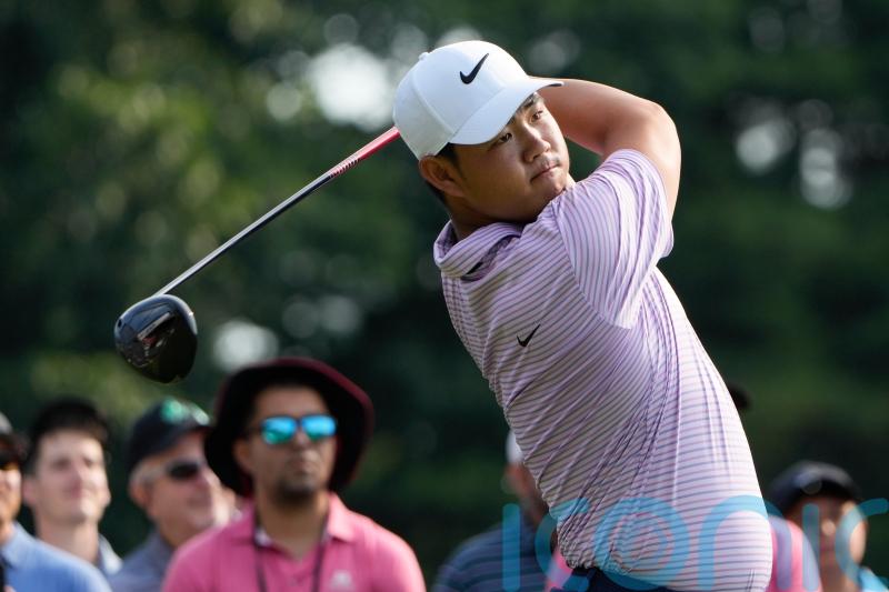 Tom Kim keeps lead as Shane Lowry and Robert MacIntyre shoot into contention
