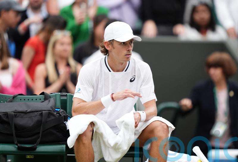 Alex De Minaur reaches first Wimbledon quarter-final but suffers injury scare