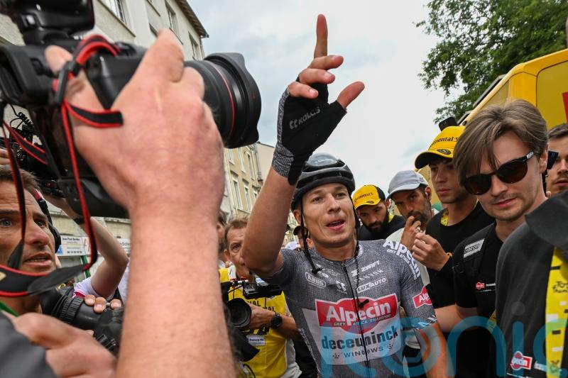 Jasper Philipsen holds off Wout Van Aert to win stage 13 sprint after late crash