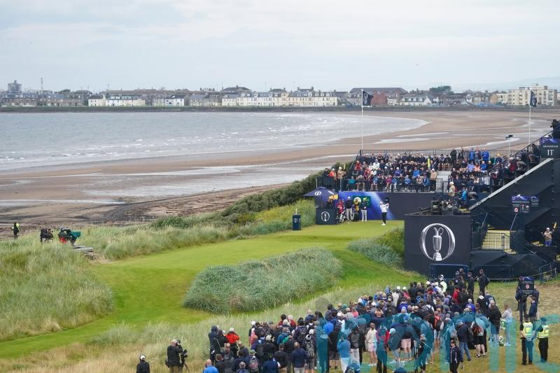 Justin Leonard hits the first shot of the 152nd Open at a cloudy Troon