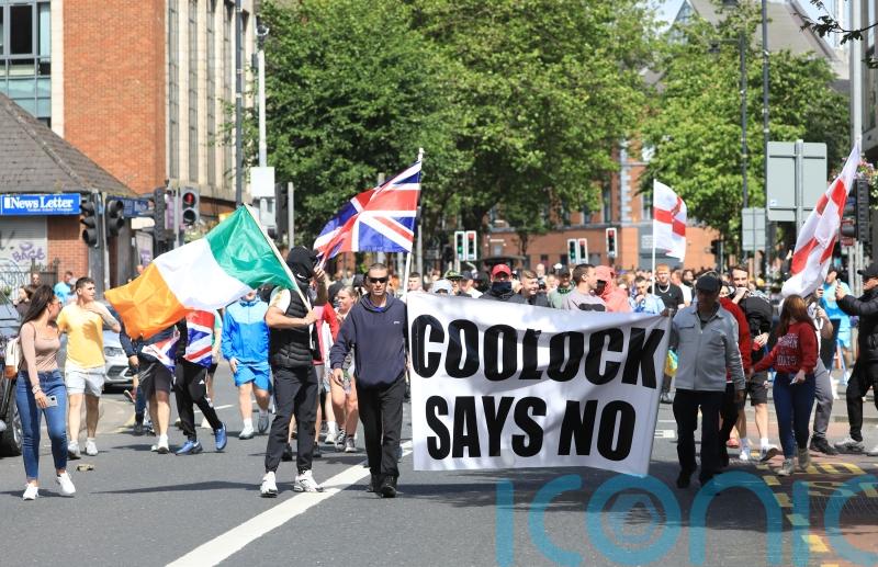 Harris expresses &lsquo;disgust&rsquo; at Irish tricolour flown during attacks on police