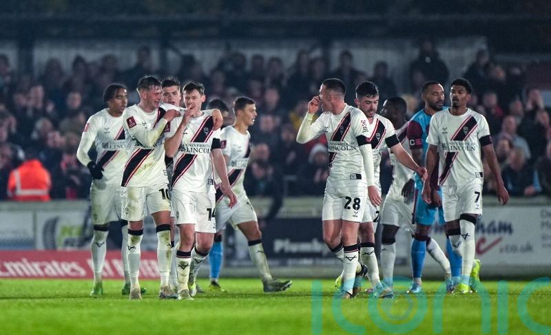 Lincoln ease past non-league Chesham to reach FA Cup second round